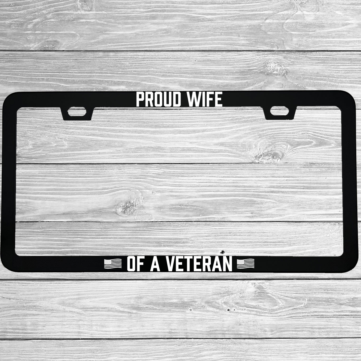 Close-up of "Proud Wife Of A Veteran" license plate frame showing fade-proof print quality
