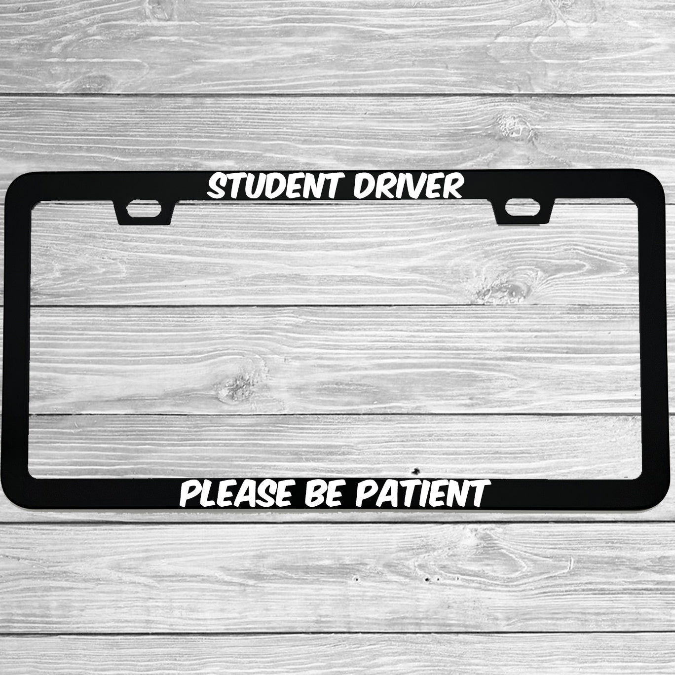 Close-up of "Student Driver" license plate frame showing fade-proof print quality